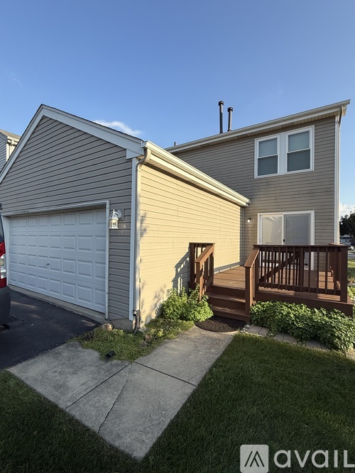 A house with a garage and a deck.