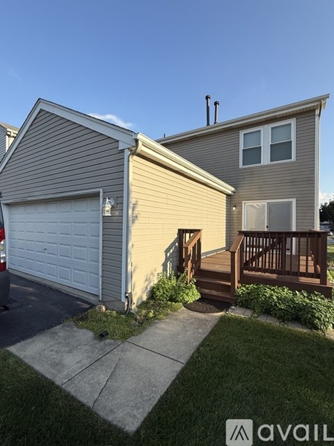 A house with a garage and a deck.