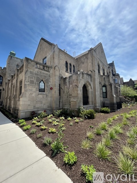 A large, old building with the word "Teach" written on it.