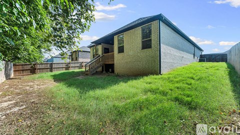 A house with a yard is for sale.