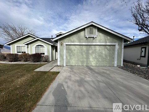 A house with a garage is for sale.