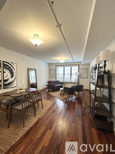 A living room with wooden floors and furniture.