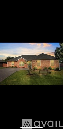 A house with a lawn in front of it.