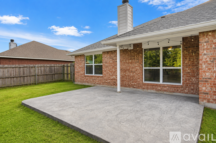 A house with a brick exterior and a grey roof.
