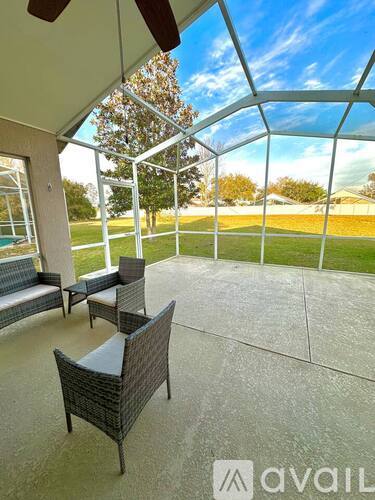 A patio with a table and chairs is shown.