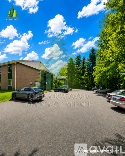 A car is parked in front of a house with the text "DARWOOD MANAGEMENT" on the front.