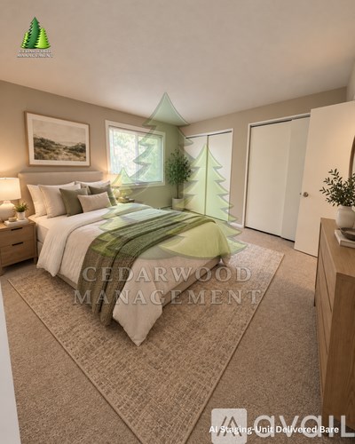A bedroom with a bed, nightstand, and a wall-mounted picture with a green tree design.
