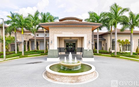 A building with a fountain in front of it.