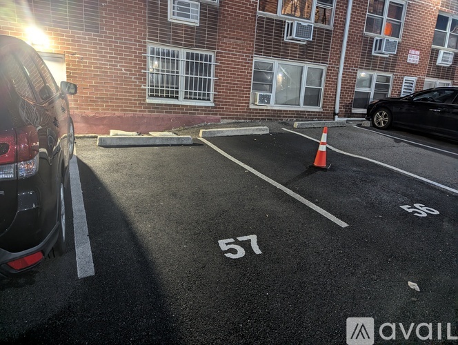 A parking lot with the number 57 painted on the pavement.