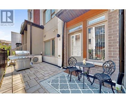 A patio with a table and chairs is shown.