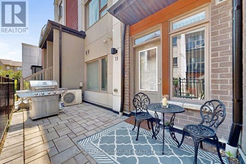 A patio with a table and chairs is shown.