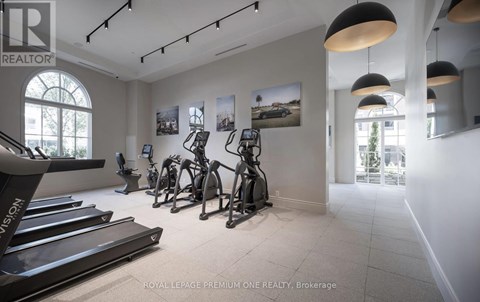 A gym with treadmills and exercise bikes.
