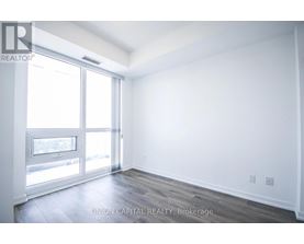 A white room with a sliding glass door.