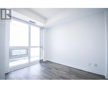 A white room with a sliding glass door.