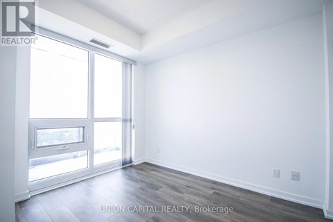 A white room with a sliding glass door.