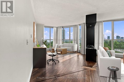 A modern living room with a view of the city.