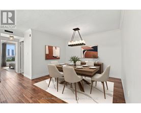 A dining room with a wooden table and chairs.