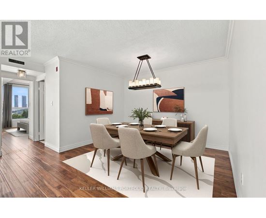 A dining room with a wooden table and chairs.