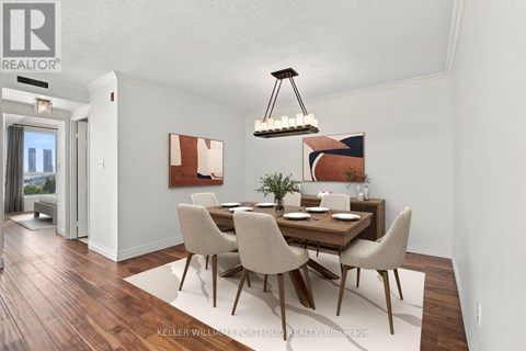 A dining room with a wooden table and chairs.