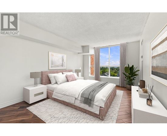 A bedroom with a large bed and a view of the outside.