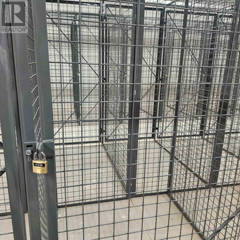A metal gate with a lock is closed.