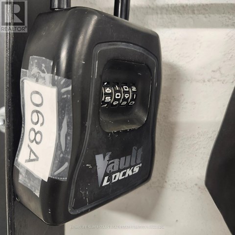 A black Vault Locks keypad is labeled with the number 0684.