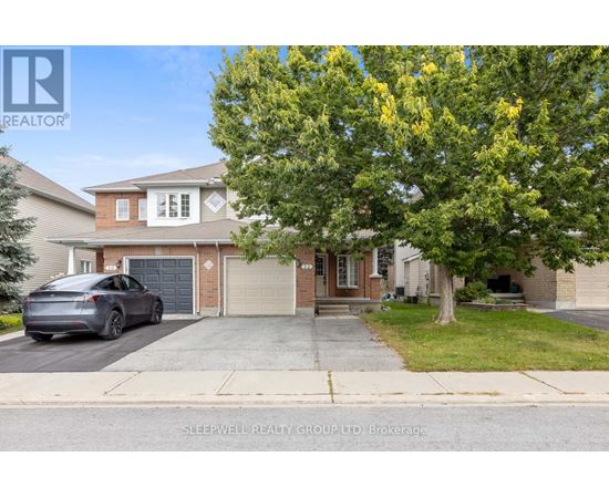 A house with a tree in front of it and a car parked in the driveway.