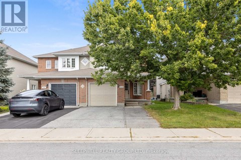 A house with a tree in front of it and a car parked in the driveway.