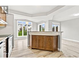 A kitchen with a wooden island and cabinets.