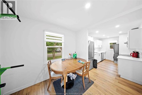 A dining room with a table and chairs is shown.