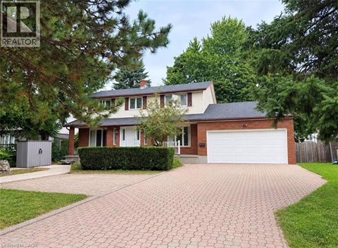 A house with a driveway in front of it.