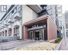 A modern building with a brown facade and glass windows is labeled with the number 01.