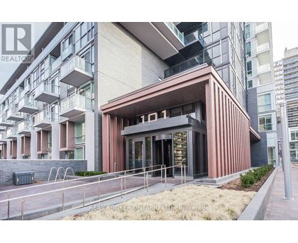 A modern building with a brown facade and glass windows is labeled with the number 01.