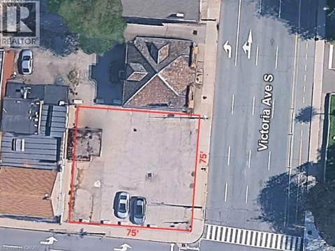 A satellite image of a street corner with Victoria Ave and a red outlined property.