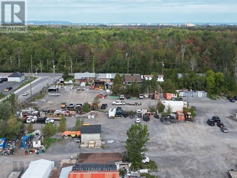 A large industrial area with a variety of vehicles and buildings.