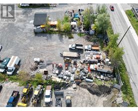A construction site with heavy machinery and vehicles.