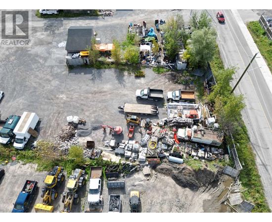 A construction site with heavy machinery and vehicles.