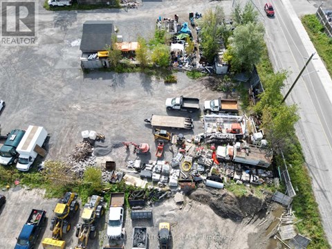 A construction site with heavy machinery and vehicles.