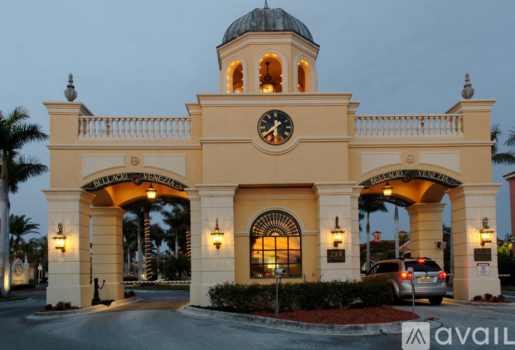 A building with a clock tower and a sign that says "Bellagio" on it.