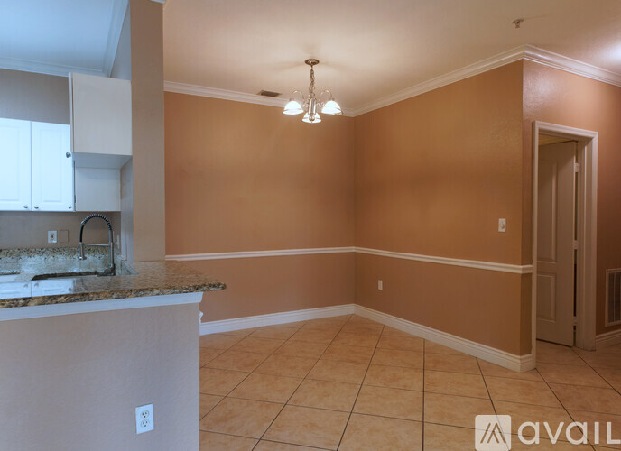A kitchen area with a counter and cabinets.