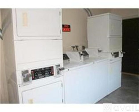 A white refrigerator and freezer are in a room.