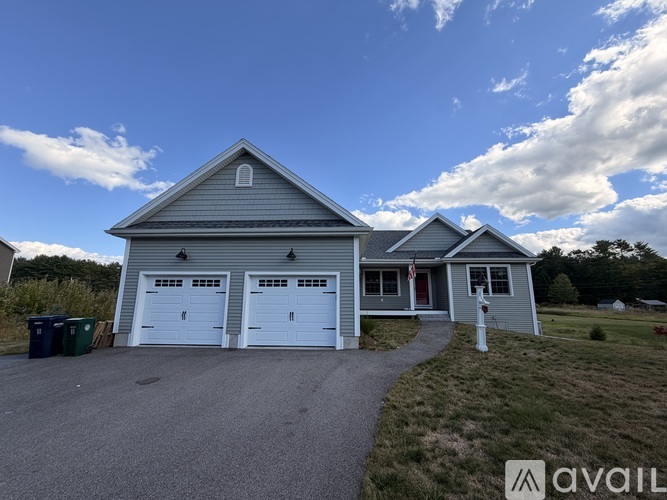 A two-car garage is attached to a house.