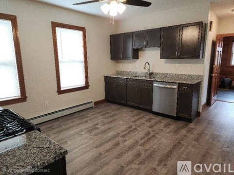 A kitchen with a stove top oven and a counter top.