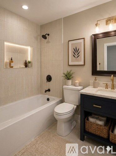 A bathroom with a white toilet, a white bathtub, and a sink with a mirror above it.