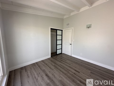 A room with a door and a window.