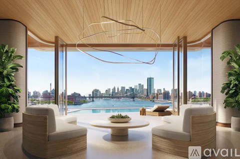A modern living room with a view of the city skyline.