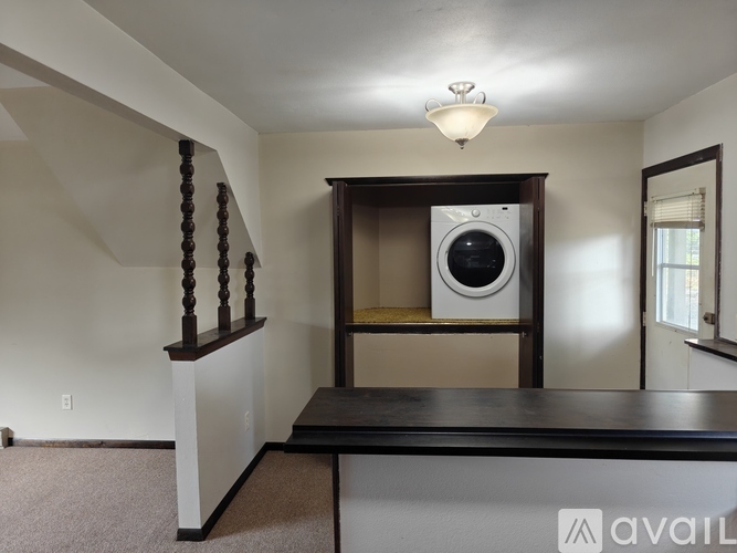 A laundry room with a washer and dryer in it.