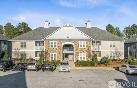 A building with a parking lot in front of it.