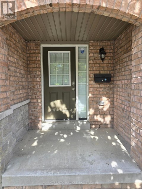 A doorway with a glass door and a small window above it.