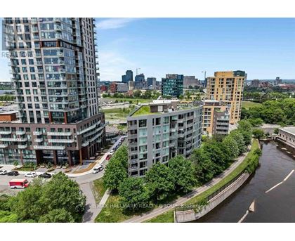 A river runs through a city with buildings on both sides.